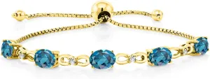 Gem Stone King 7X5MM Oval Cut Gemstone Birthstone and Accent Lab Grown Diamond Tennis Bracelet For Women In 18K Yellow Gold Plated Silver | Adjustable Bolo Bracelet For Women | Easy-On Easy-Off